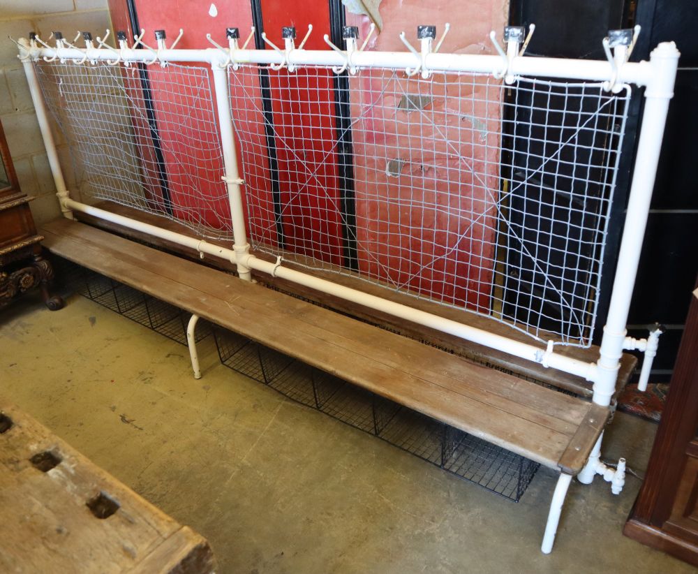 A vintage school cloakroom two sided bench, W.300cm, D.60cm, H.132cm